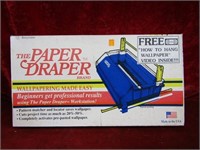 Paper draper. Wall paper machine in box.