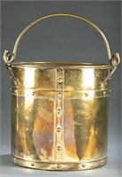 Brass bucket with swing handle.
