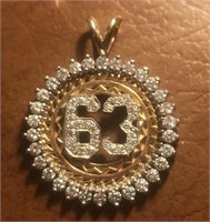 A 14kt gold and Diamond anniversary pendant