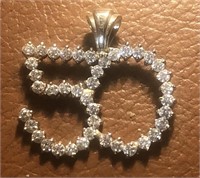 A 14kt gold and Diamond 50th anniversary pendant