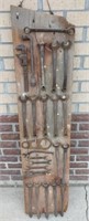 24 Ford wrenches mounted on barn board