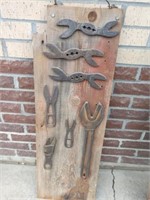 Alligator wrenches on barn board