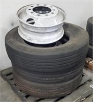Pallet of bus rims and tires
