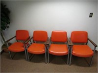 (4)Orange office chairs.