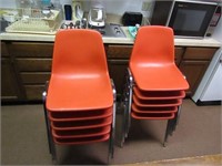 (10)Orange stacking chairs.