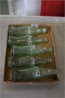 5 Coke Bottles