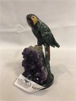Hand cut quartz stone with parrot cut from jade