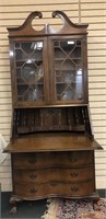 Mahogany secretary with slant top and broken arch