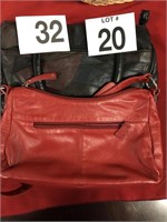 Two genuine leather purses one red one black and