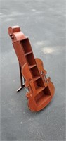 Unique violin shaped shelf.  Stands 29 in. Tall