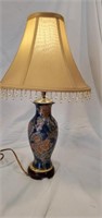 19 inch tall table lamp.  Cute flower design in