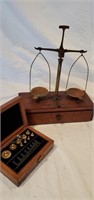 Vintage balance scale and weights. In wood box