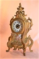 Waterbury metal cased shelf clock, beveled glass