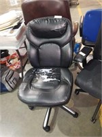 Black office chair worn