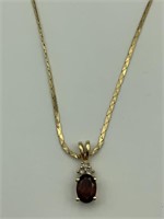 14K YG necklace w/garnet & diamond pendant