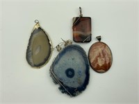 Lot of 4 polished stone pendants