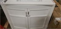 White vanity with doors and white sink top