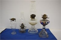 3 OIL LAMPS AND A BURNER WITH CHIMNEY