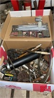 Box with miscellaneous grease gun, nuts, bolts