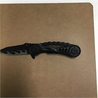 Black knife with flame on blade