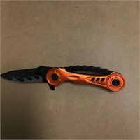 Orange knife with flame on blade