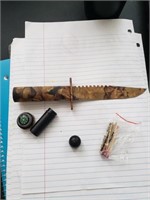 Knife with sheath includes matches and fishing