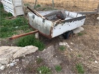Small utility trailer with contents. Flat tires