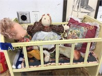 Metal doll crib with dolls