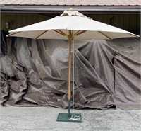 (2) pcs - Patio umbrella with cast iron stand.