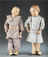 2 Schoenhut wood dolls with sculpted hair.