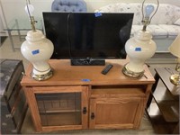 TV, cabinet and lamps