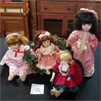 Group of 4 dolls with wooden bench