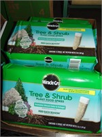 Flat full of new in pkg. tree and shrub stakes