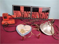 "No Hunting" signs, heat lamp, sander