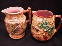 Two majolica serving pitchers: 7 1/4" decorated