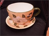 Planter in the shape of a teacup and saucer,