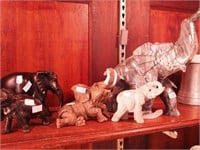 Five elephant figurines made out of onyx, metal,