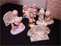 Five figurines, mostly Precious Moments,