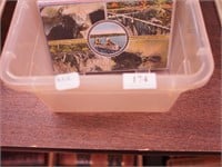 Container of vintage postcards, mostly places