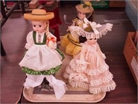 Three 12" and one 15" collector dolls including