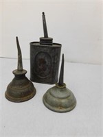 Three small antique oil cans
