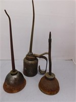 Three antique oil cans: one Eagle pump style -