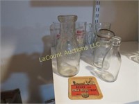 assorted vintage milk bottles