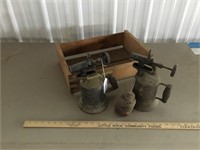 Antique torches, oil can, wooden box