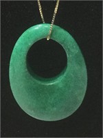 Jade Oval pendant on 20” 14k gold chain.
