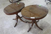 Pair of oval mahogany glass top side tables with b