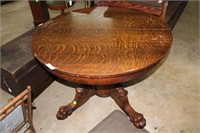 Round Tiger Oak dining table with Lion Head and pa