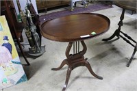 Gallery top harp base oval mahogany side table 24"