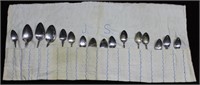 TWELVE 800s silver serving and dinner spoons