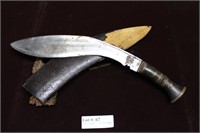 Kukri knife in wooden sheath